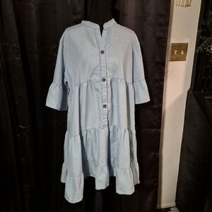 Light blue tiered denim babydoll dress with a v-neck, button-down front. Y2K